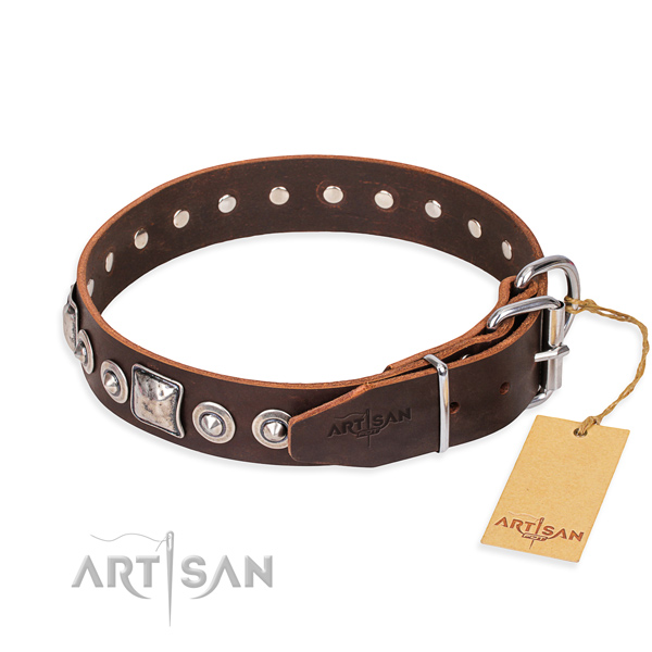 Natural genuine leather dog collar made of soft to touch material with corrosion resistant decorations